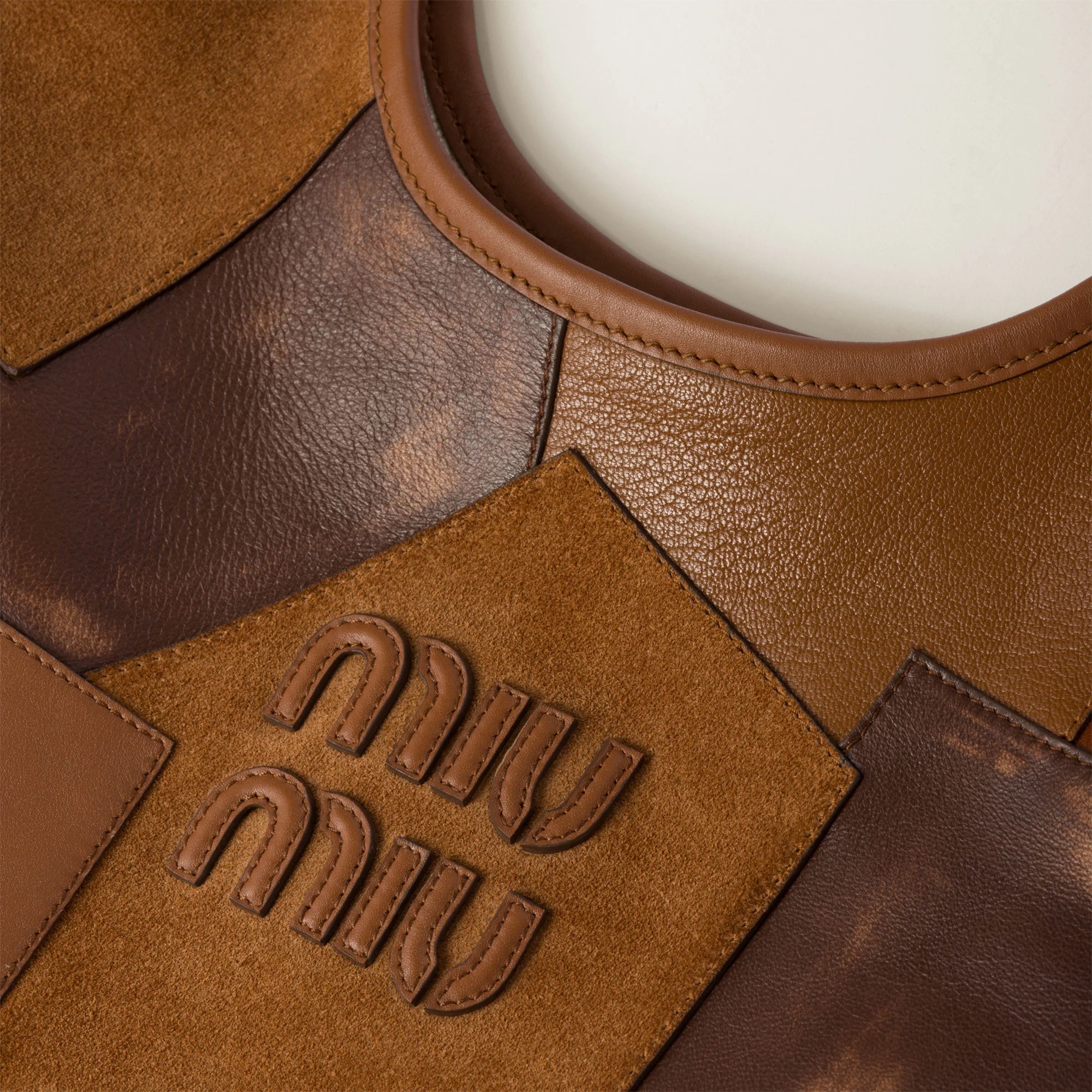 Cognac IVY leather patchwork bag, € 2450 (approximately P156,084.60), MIU MIU, miumiu.com